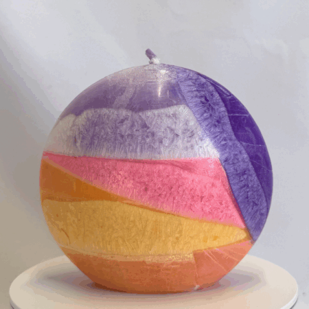 Bougie disque 10 cm en cire d’olive - violet, rose, jaune et orange — surface lisse, cœur cristallisé