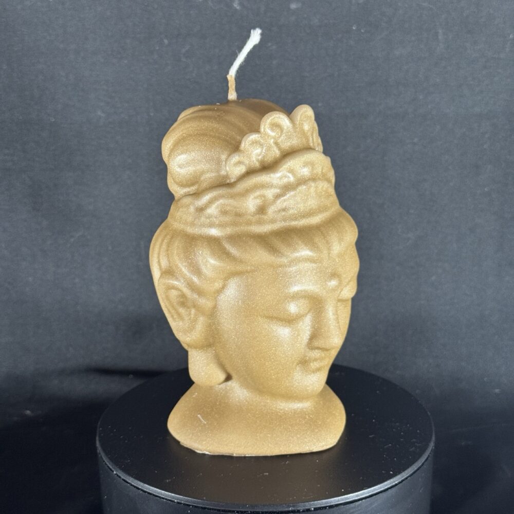 Bougie visage féminin dorée — collection Champagne doré, cire végétale et minérale, finition satinée.