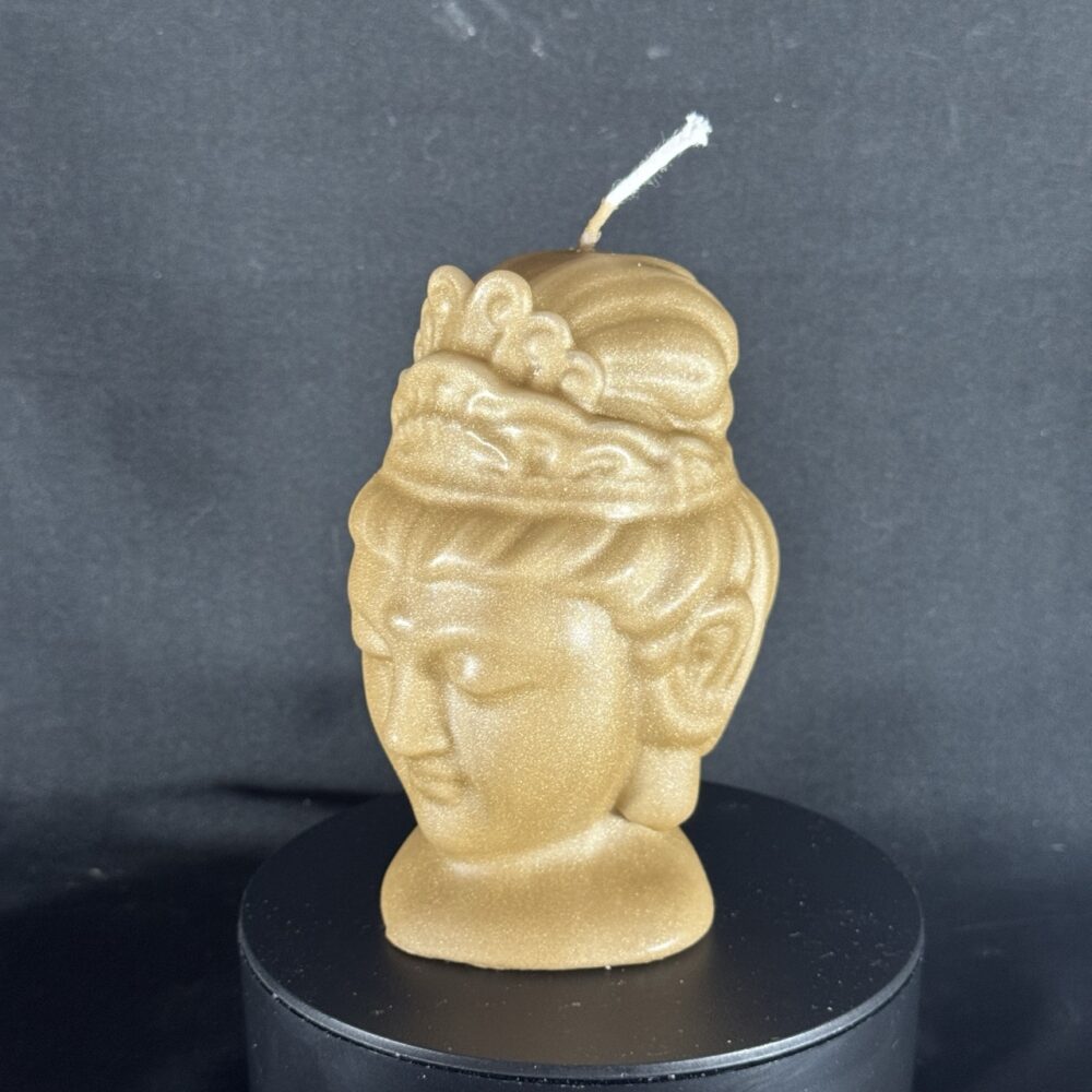 Bougie visage féminin dorée — collection Champagne doré, cire végétale et minérale, finition satinée.