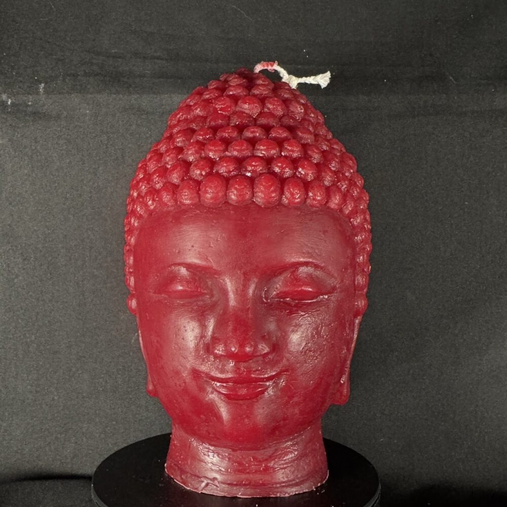 Bougie visage Bouddha bordeaux en cire minérale, moulée à la main dans le canton de Vaud.